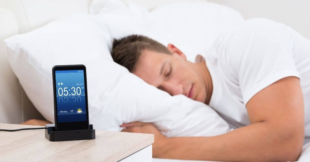 man using app to fall asleep